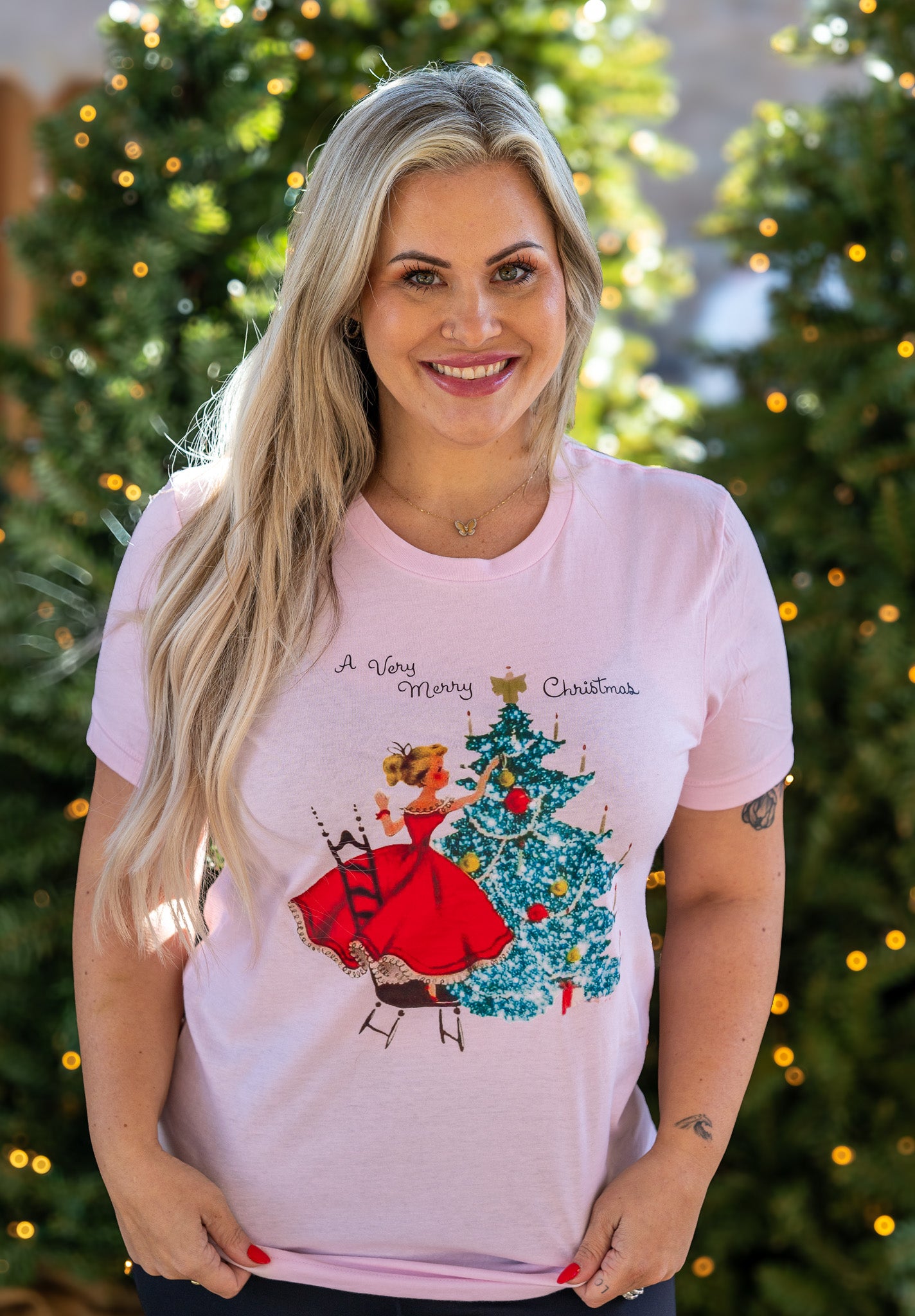 Amanda Bright Designs A Very Merry Christmas vintage style pink graphic t-shirt 1950s woman decorating christmas tree