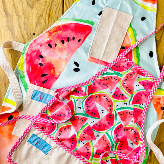 Two Medium Sized Ladies Shelby watermelon summer mommy and me matching apron set handmade pink gingham trim and apron strings cotton watercolor style