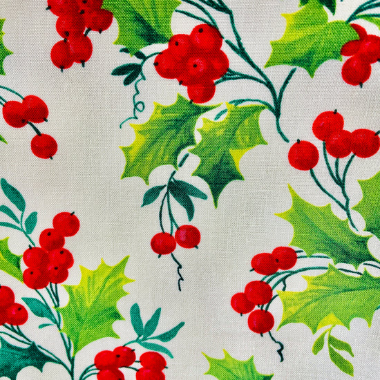 Two Medium Sized Ladies bright red berries and bright green holly leaves on the pattern for holly berry winter wonderland apron
