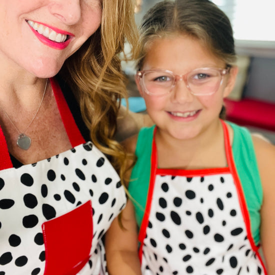 Two Medium Sized Ladies Dalmatian Print Mommy & Me Apron Set Children's Adult White with Black Spots Red Trim and Red Apron Strings Made in Texas
