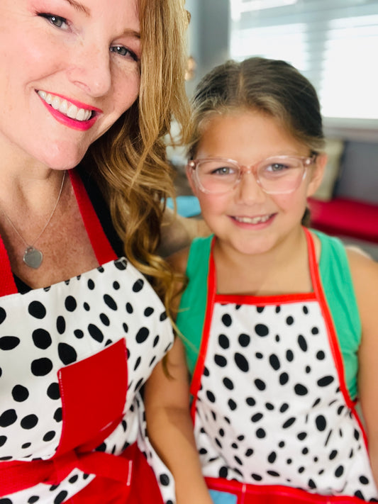 Two Medium Sized Ladies Dalmatian Print Mommy & Me Apron Set Children's Adult White with Black Spots Red Trim and Red Apron Strings Made in Texas