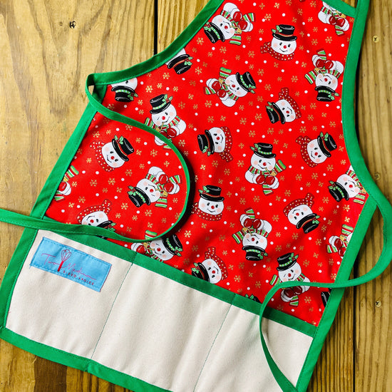 Two Medium Sized Ladies Vintage Frosty the Snowman Vintage Children's Christmas Aprons Red with Gold Snowflakes Flecks and Green Apron Strings