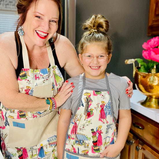 Two Medium Sized Ladies Mommy and me Audrey I love Paris apron set adult children's styles Eiffel Tower midcentury fashion France