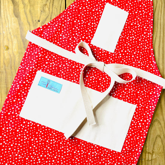 Two Medium Sized Ladies Vintage Style Snow on Vintage Snowfall Apron white snowflakes with bright red background polished cotton