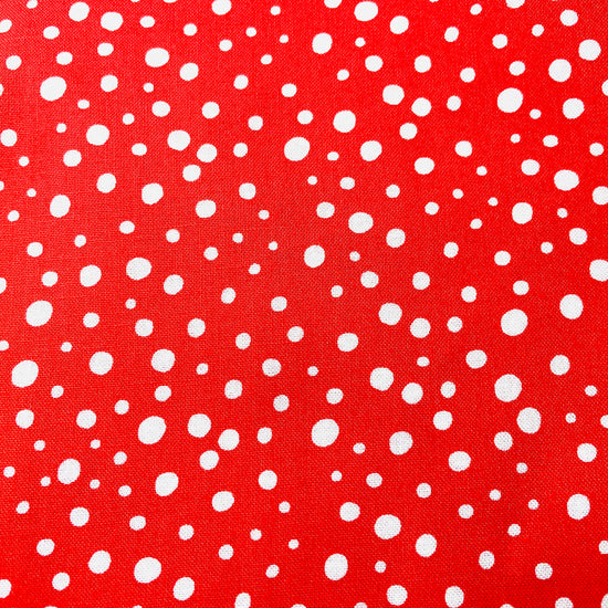 Two Medium Sized Ladies quilting cotton fabric with vintage snowflake pattern for vintage snowfall apron red background with white snowflakes