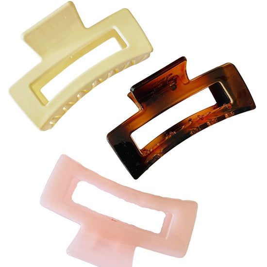 Amanda Bright Designs Three rectangular hair clips in beige, tortoiseshell, and pink on a white background