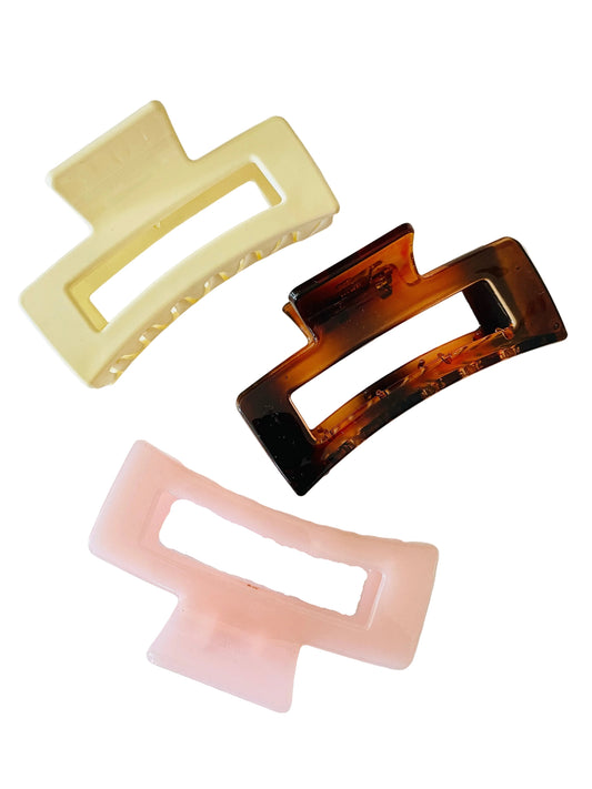 Amanda Bright Designs Three rectangular hair clips in beige, tortoiseshell, and pink on a white background