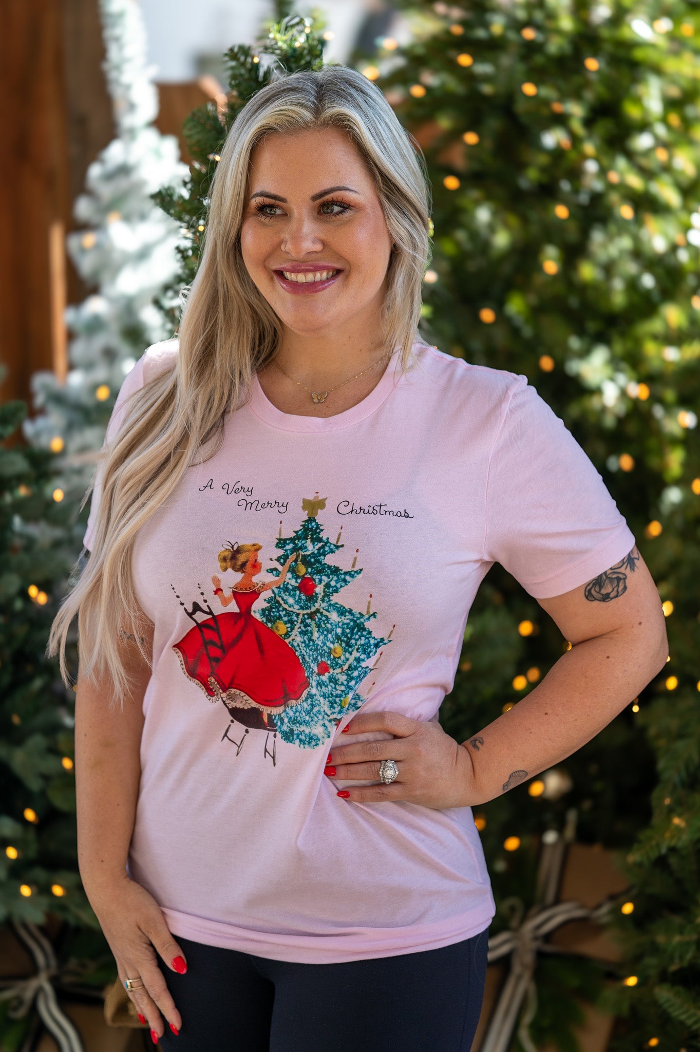 Amanda Bright Designs A Very Merry Christmas vintage style pink graphic t-shirt 1950s woman decorating christmas tree