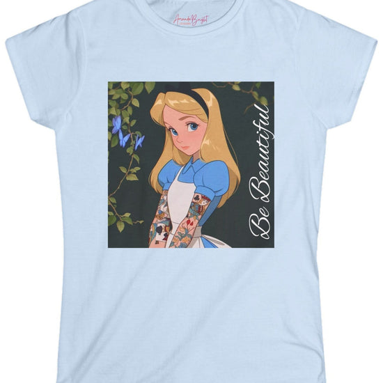 Amanda Bright Designs graphic tshirt Be Beautiful series Alice in Wonderland tattooed sleeve light blue short-sleeve t-shirt with a graphic print of Alice from Alice in Wonderland, featuring her blonde hair, blue dress, and the text 'Be Beautiful' written vertically on the right side of the graphic.