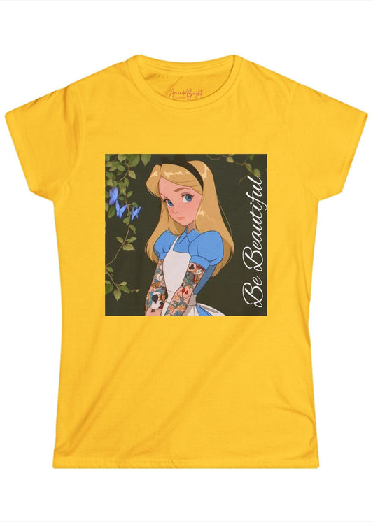 Amanda Bright Designs graphic tshirt Be Beautiful series Alice in Wonderland tattooed sleeve yellow gold short-sleeve t-shirt with a graphic print of Alice from Alice in Wonderland, featuring her blonde hair, blue dress, and the text 'Be Beautiful' written vertically on the right side of the graphic.