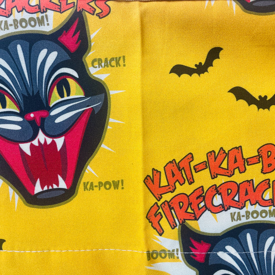 Amanda Bright Designs Ka-Boom Black Cat Fireworks Yellow and Black Bats Halloween themed Apron