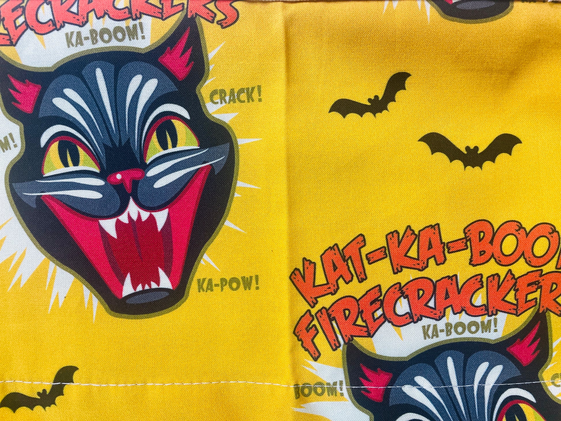 Amanda Bright Designs Ka-Boom Black Cat Fireworks Yellow and Black Bats Halloween themed Apron