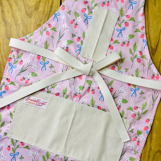 Amanda Bright Designs pink apron with strawberries blue bows white flowers