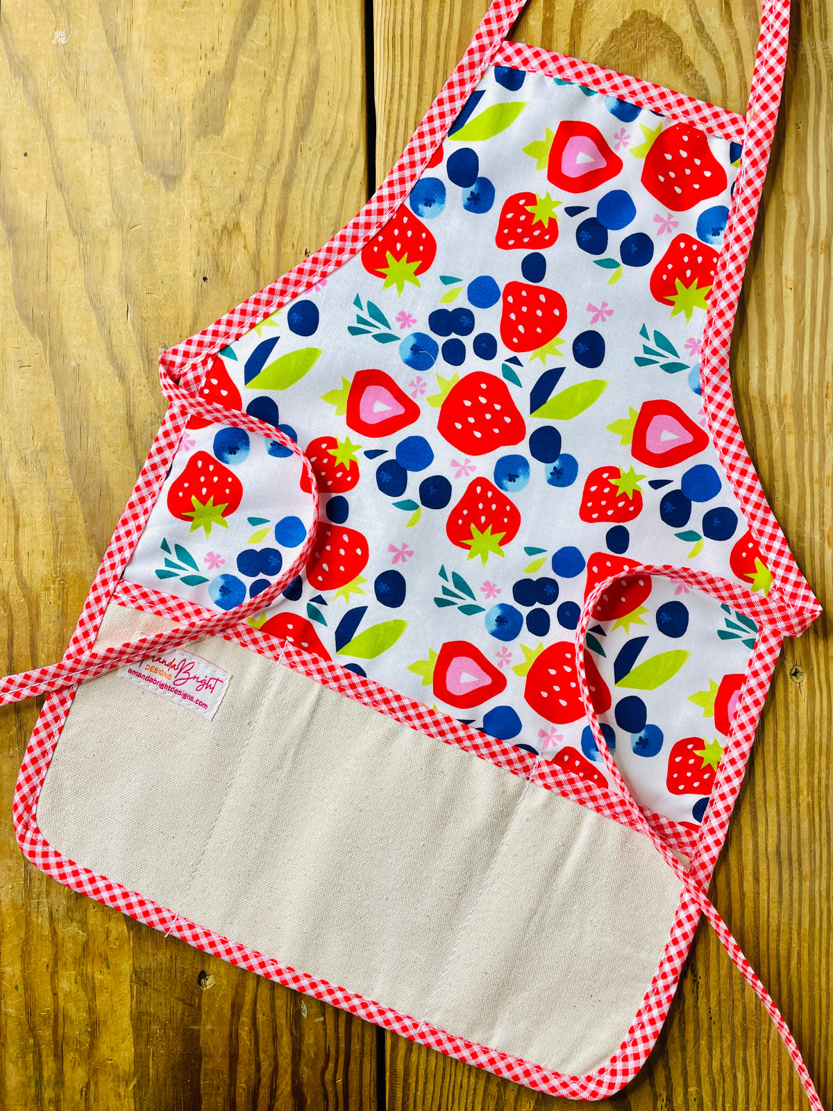 Amanda Bright Designs children’s summer apron berries galore strawberries blueberries red gingham trim 
