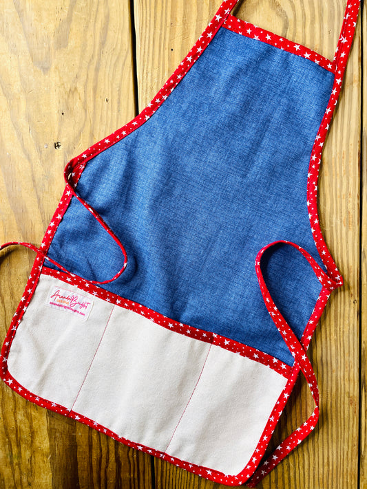 Amanda Bright Designs handmade dark wash denim apron with canvas pockets and deep red stars trim