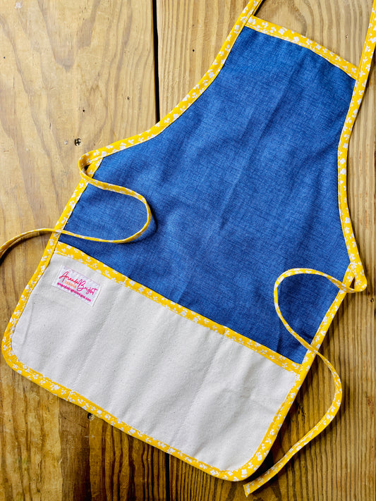 Amanda Bright Designs handmade dark wash denim apron with canvas pockets and yellow floral trim