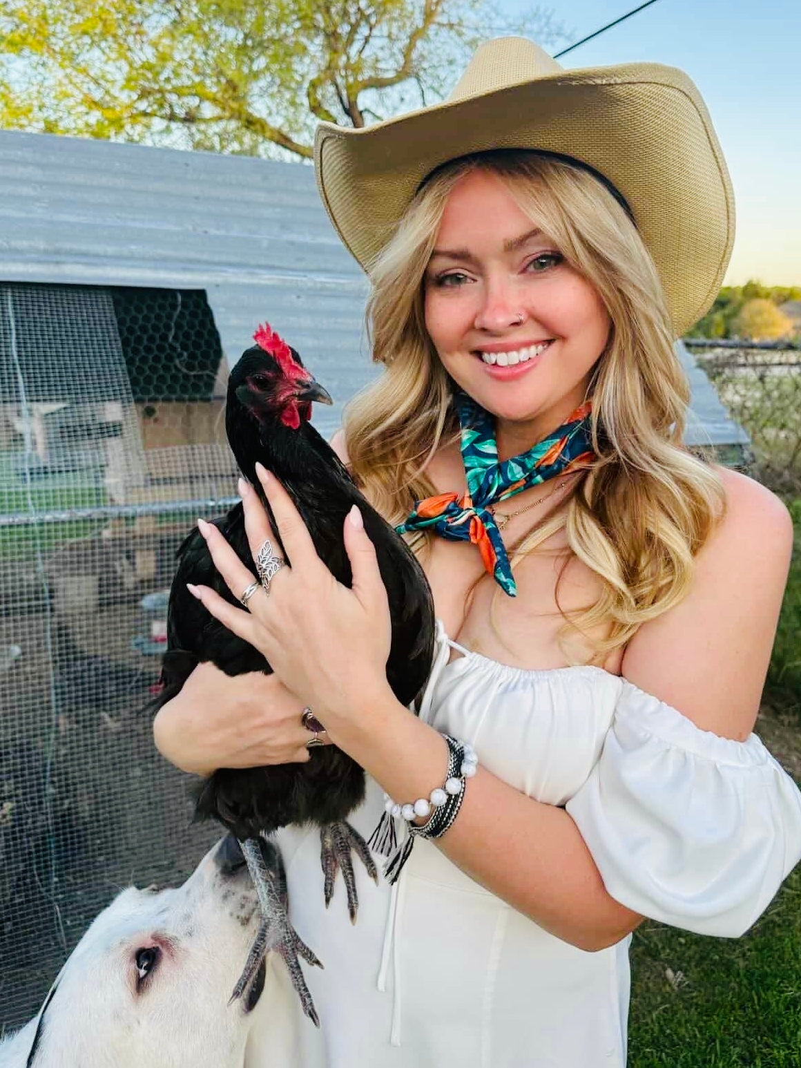 Amanda Bright Designs citrus summer headband with orange slices on woman holding chicken wearing cowboy hat