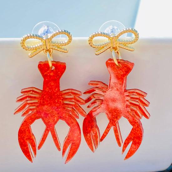 Amanda Bright Designs crawfish acrylic earrings with gold bow
