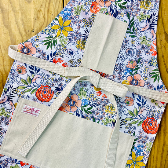 Amanda Bright Designs brightly colored floral patterned apron with pockets and strings