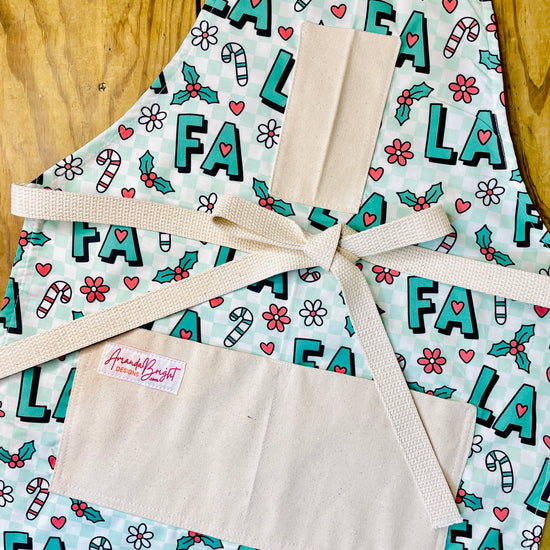 Amanda Bright Designs Fa La La Christmas Apron in green checkered with candy canes and flowers