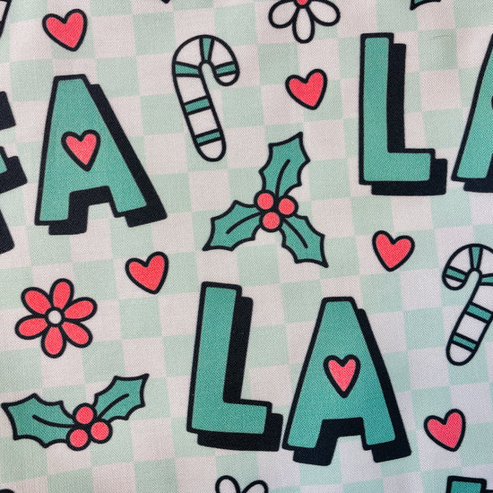 manda Bright Designs Fa La La Christmas Apron in green checkered with candy canes and flowers