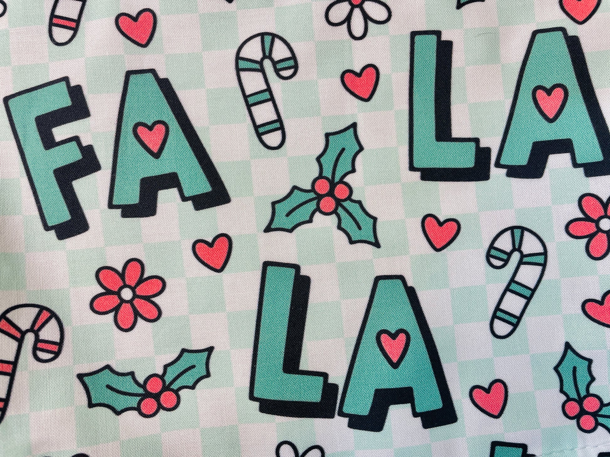 manda Bright Designs Fa La La Christmas Apron in green checkered with candy canes and flowers