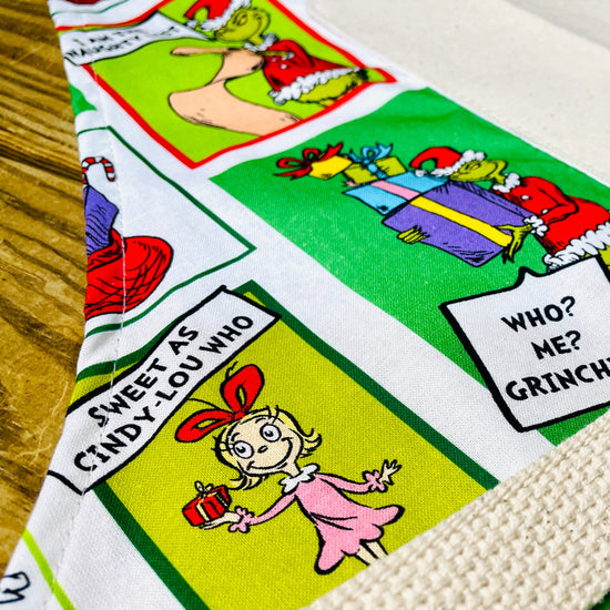 Fabric with Dr. Seuss character designs grinch cindy lou who 