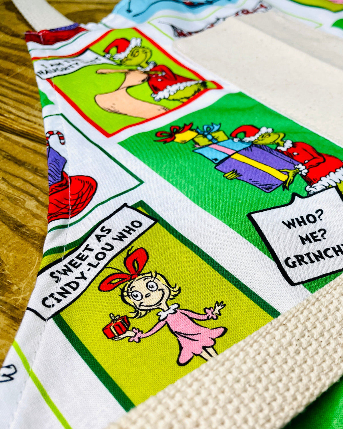 Fabric with Dr. Seuss character designs grinch cindy lou who 