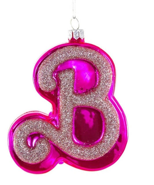 Pink glittery letter 'B' ornament on a white background