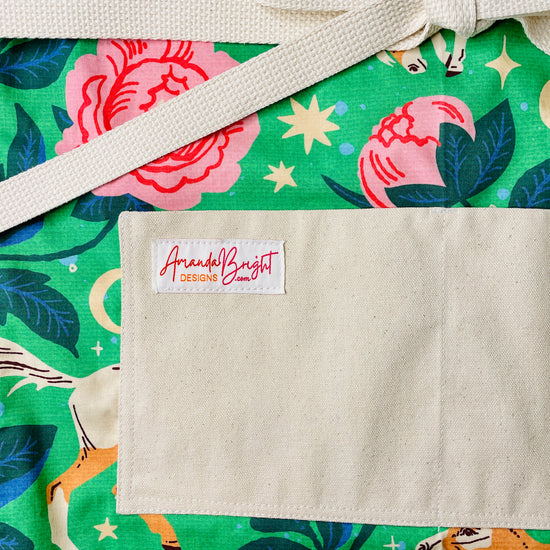 Amanda Bright Designs Green Acres apron with horse and rose floral pattern with moon and stars on green background