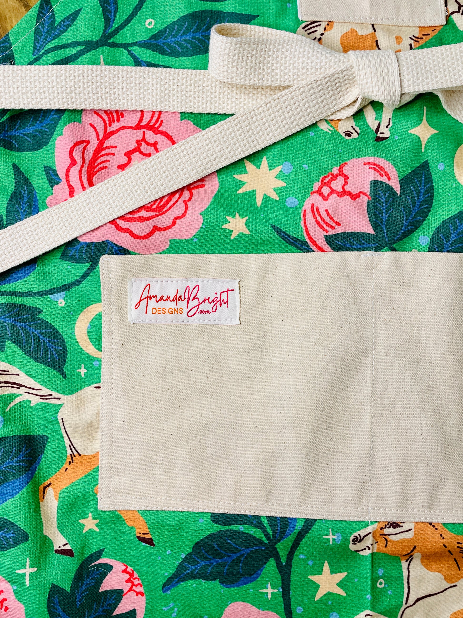 Amanda Bright Designs Green Acres apron with horse and rose floral pattern with moon and stars on green background