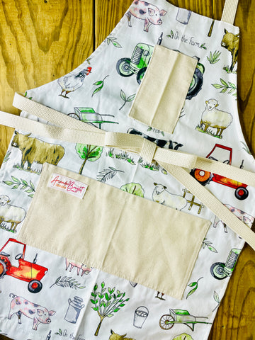 Amanda Bright Designs farm garden ranch apron highland cow wheelbarrow tractor