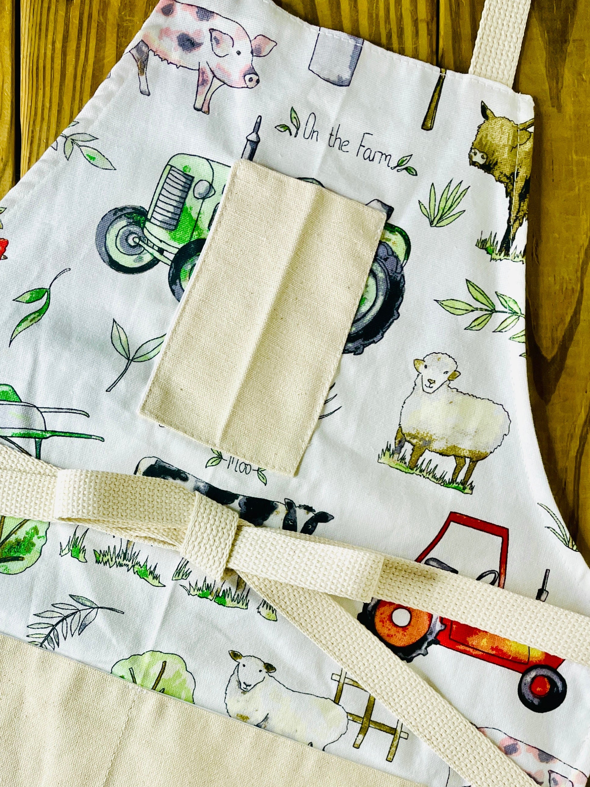 Amanda Bright designs tractor farm garden ranch highland cow apron