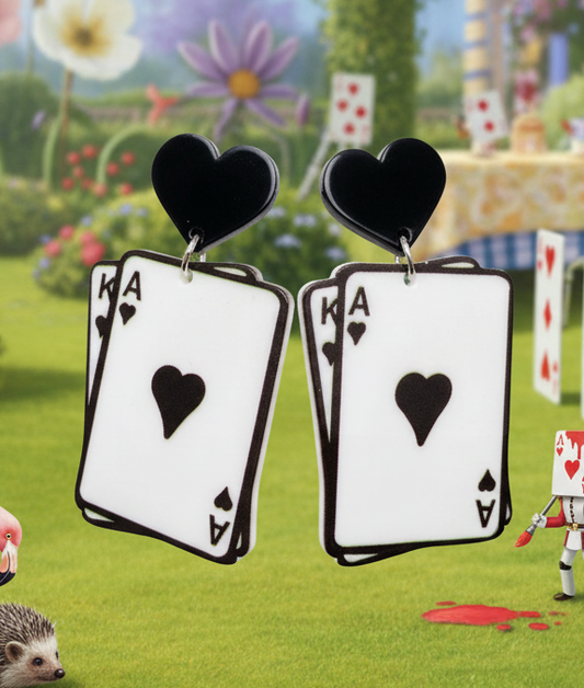 Amanda Bright Designs Playing card earrings with hearts in Alice in Wonderland backdrop