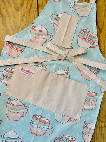 Amanda Bright Designs Oversized Hot Cocoa Mugs with Marshmallows on an apron mint green and pink candy canes