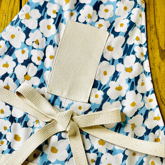 Blue and white floral cotton apron with yellow centers amanda bright desigs