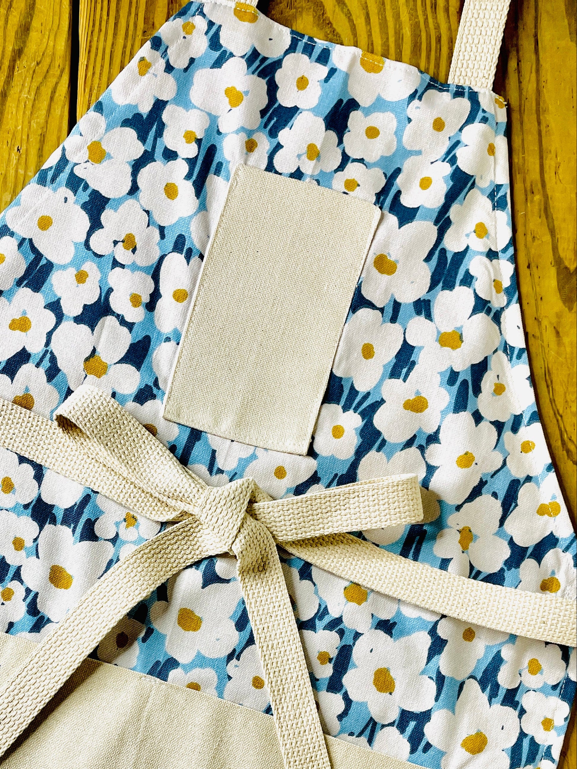 Blue and white floral cotton apron with yellow centers amanda bright desigs