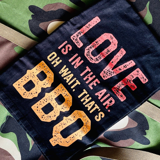 Amanda Bright Designs mens apron with Love BBQ Kitchen Towel in black with orange and red letters