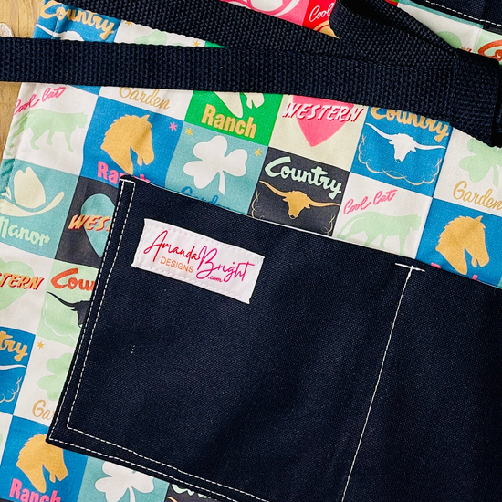 Amanda Bright Designs lucky u closeup of lower apron pockets black canvas cotton checkerboard pattern apron squares ranch western country horse chess piece steer garden