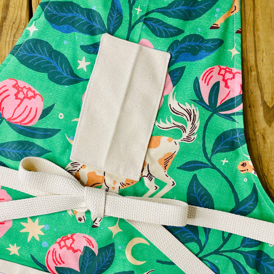 Amanda Bright Designs Moonlit Meadows apron with horse and pink peonies stars moon floral pattern on green background