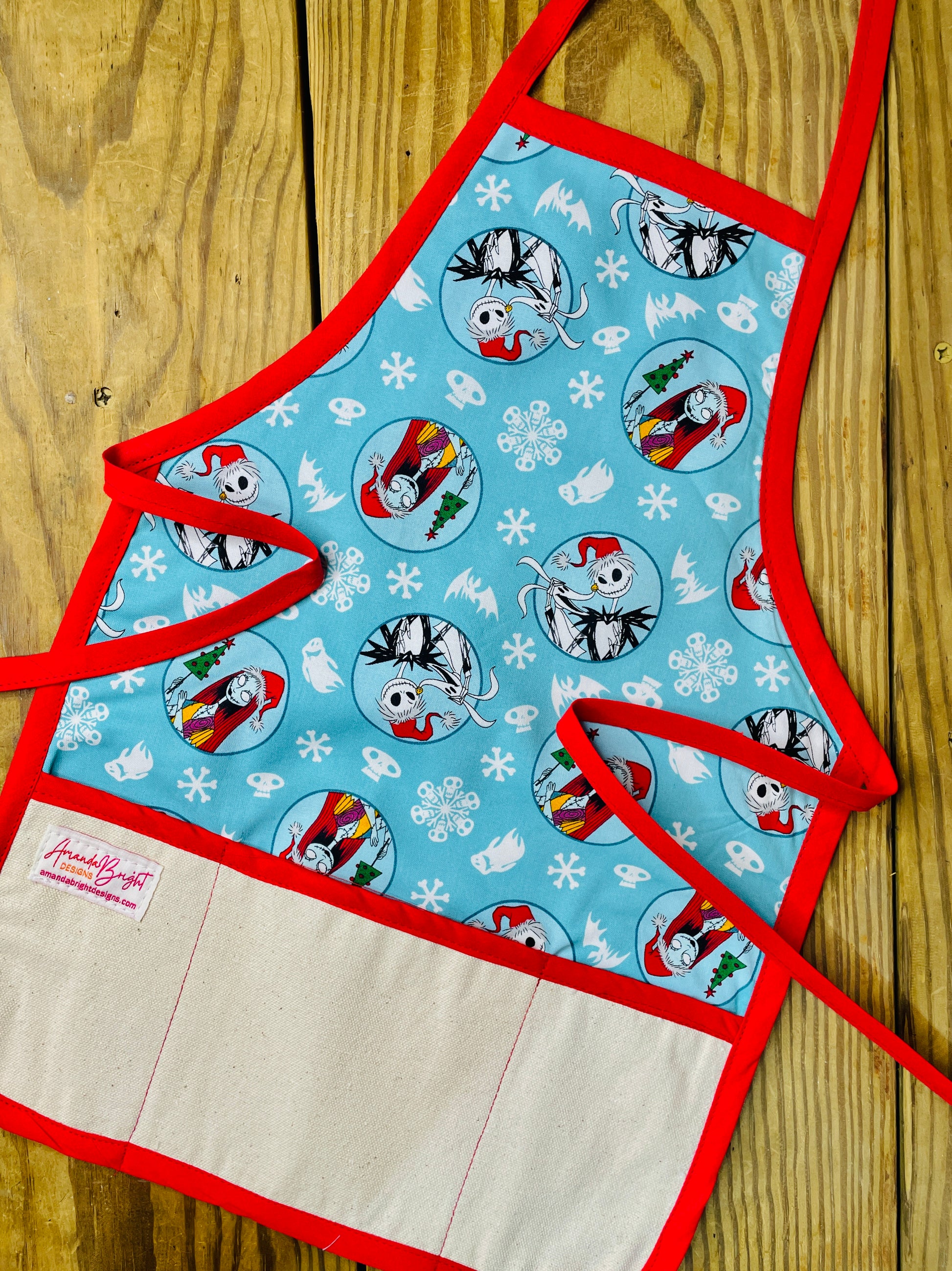 Amanda Bright Designs Children's Christmas Aprons Grinch Hello Kitty Nightmare Before Christmas Gingerbread Kitchen Baking Mommy and Me Peppermint Swirl Forest Fawn Rudolph Jack Sally