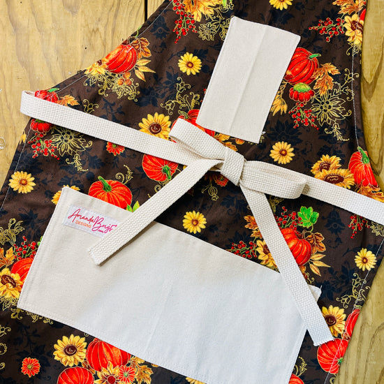 Amanda Bright Designs Nina Apron autumnal fall fabric pumpkins scrolling gold sunflowers harvest thanksgiving