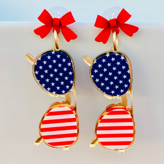 Amanda Bright Designs Sunglasses with American flag design and red bows earrings