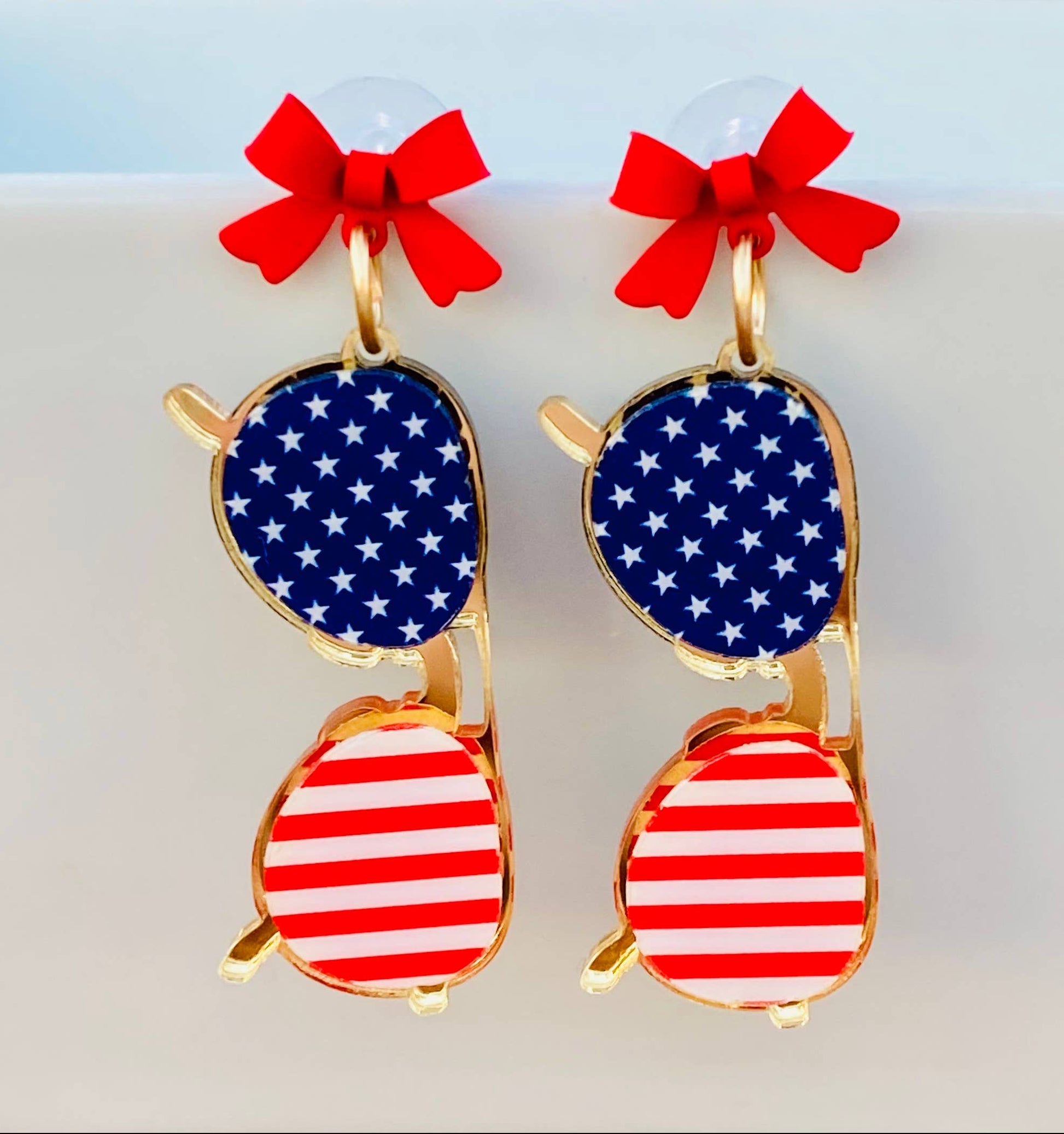 Amanda Bright Designs Sunglasses with American flag design and red bows earrings