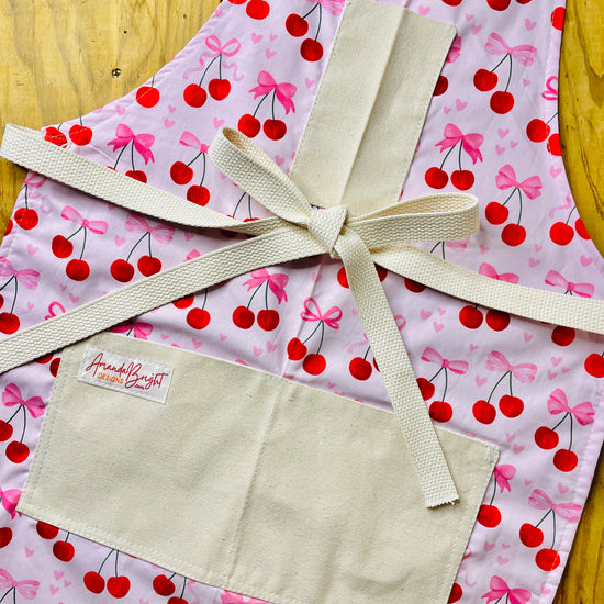 Amanda Bright Designs Pink Bows and Cherries Apron with pink hearts