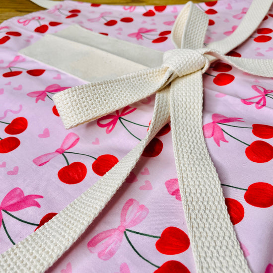 Amanda Bright Designs Pink Bows and Cherries Apron with pink hearts