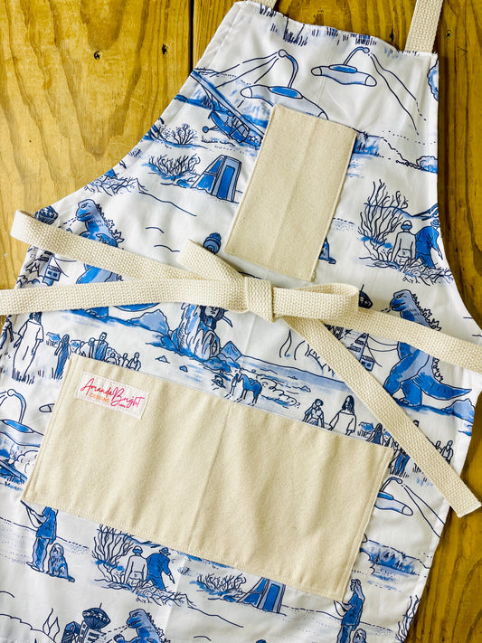 Amanda Bright Designs apocalyptic apron featuring movie scenes from Godzilla them war of the world, planet of the apes
