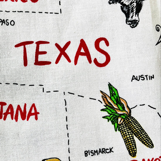 Sadie kitchen apron 50 states and their capitals historic industries road trip American heartland travel Conestoga wagon oil well longhorn airplane canoe cheese log cabin fabric pattern 