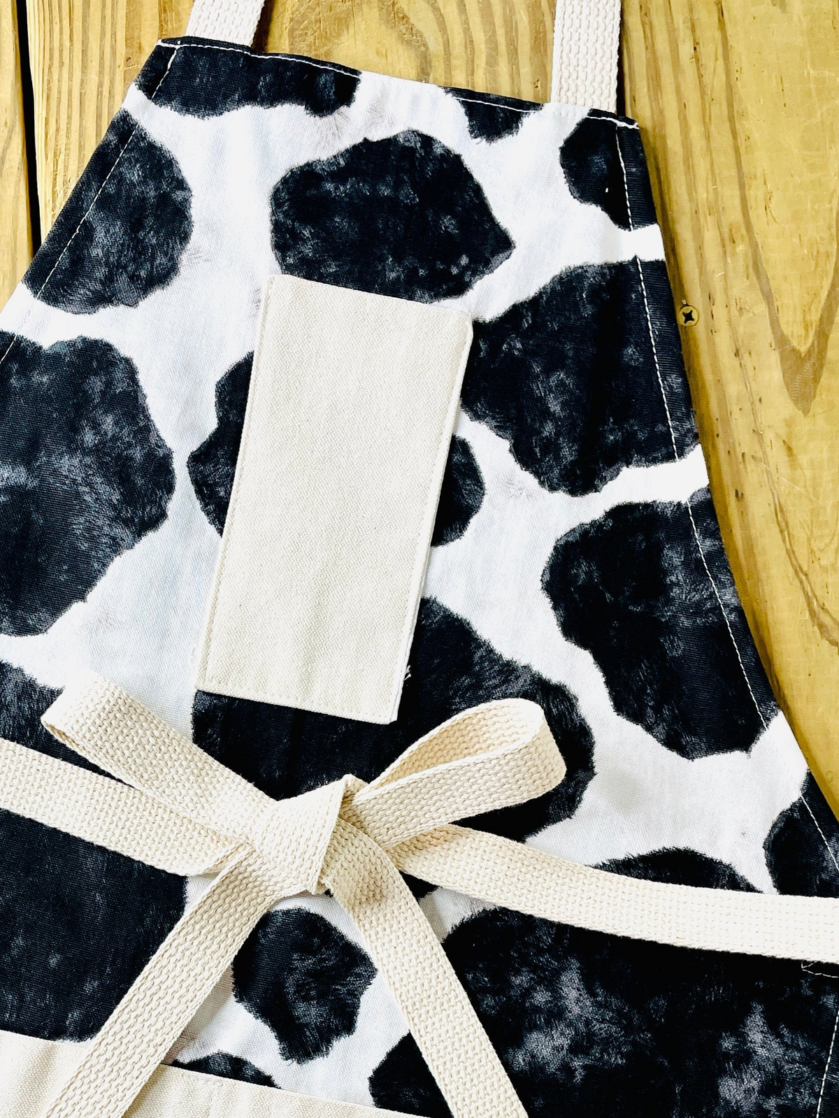 Amanda Bright designs western cowprint apron