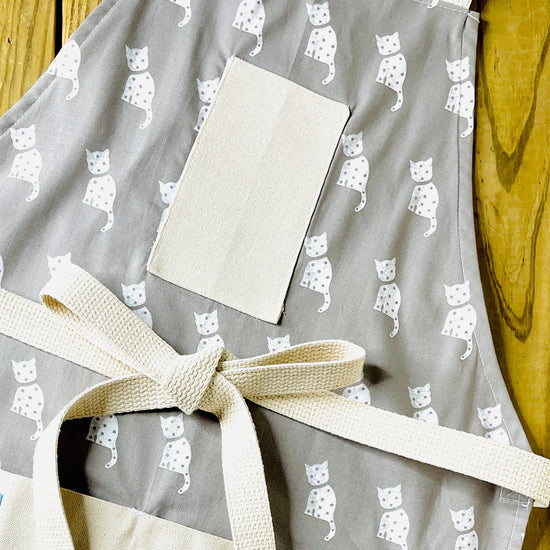 Tammi white cat on gray fabric apron cat lovers 